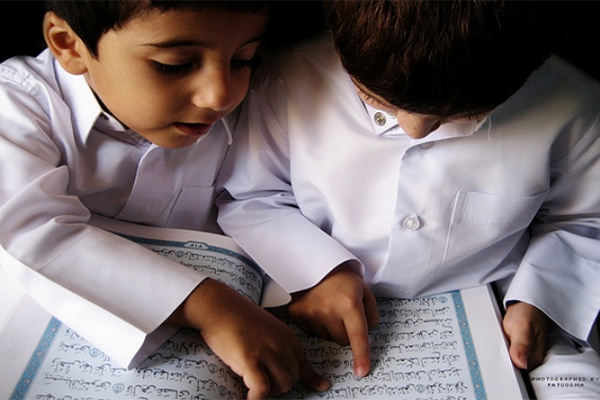 Young children learning the Holy Quran